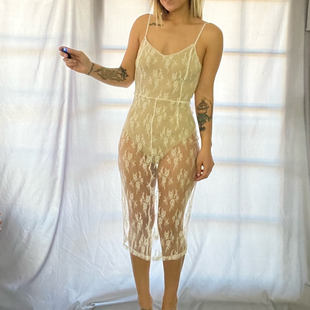 Lace dress. Size medium. Built in bodysuit. Brand new with tag.